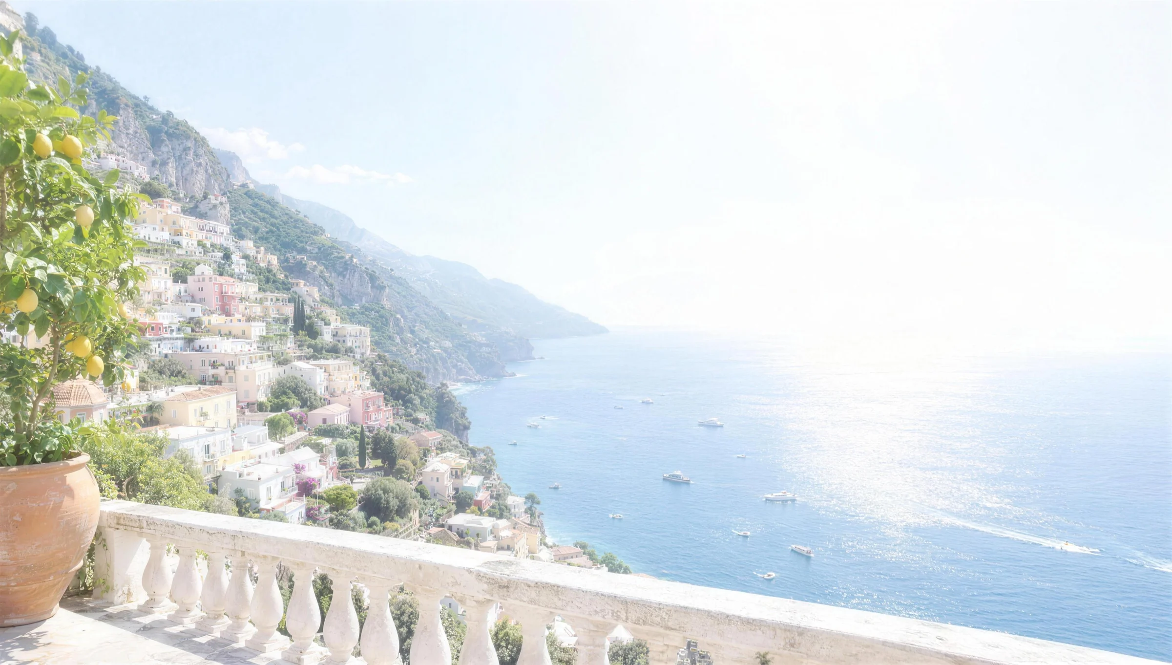 The Amalfi coast in bright midday glare, seen from a terrace